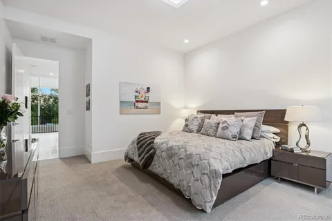 a bedroom with a bed and a couch