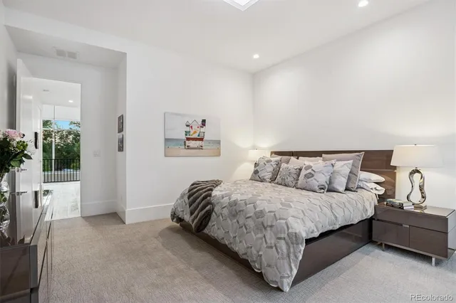 a bedroom with a bed and a couch