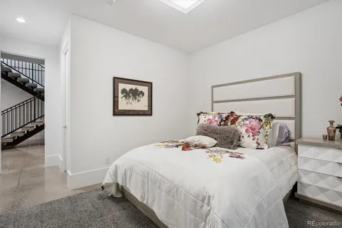 a bedroom with a large bed and a view of bedroom