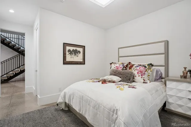 a bedroom with a large bed and a view of bedroom