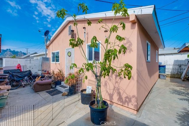 a view of a porch with potted plants