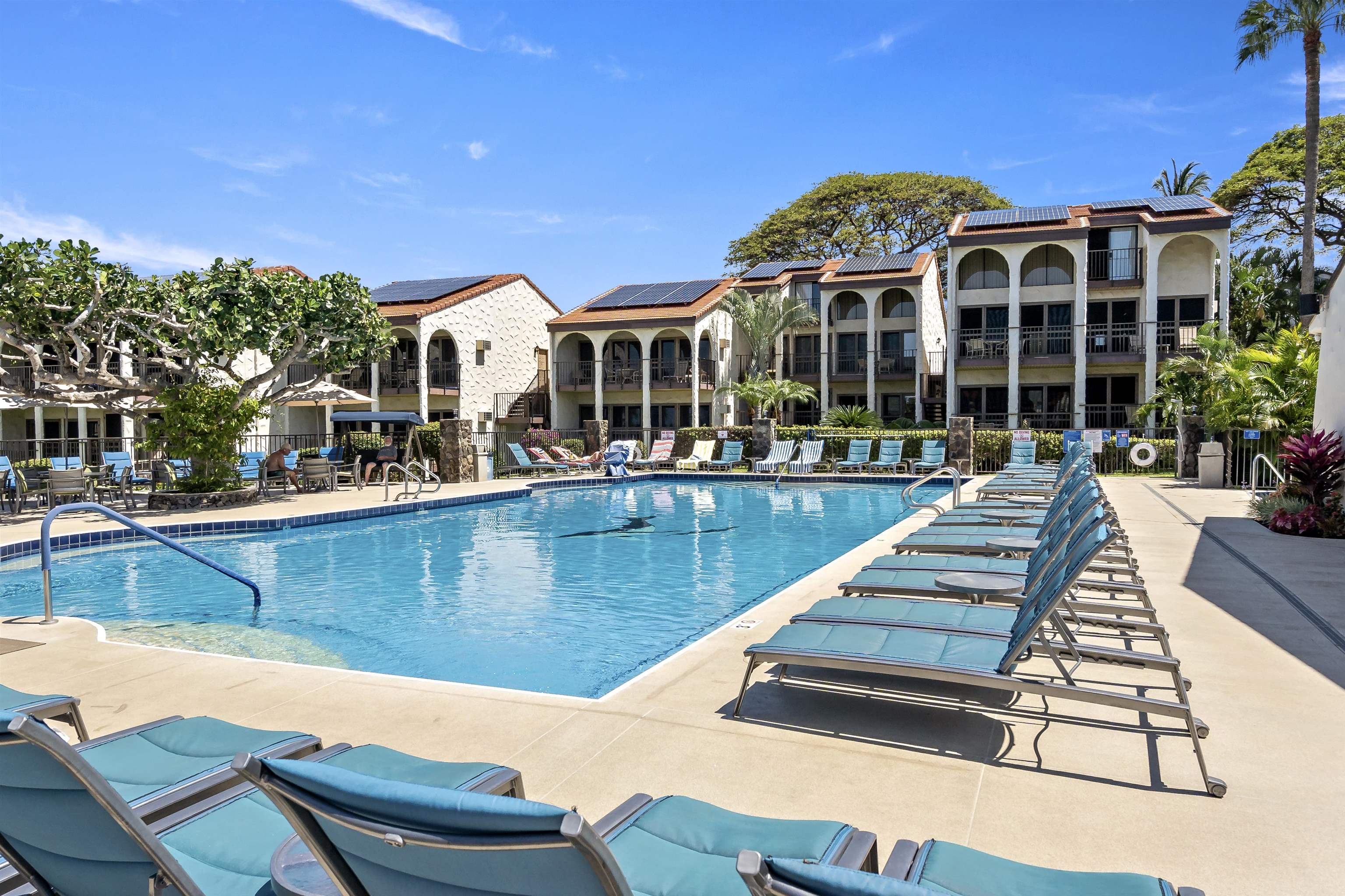 2881 South Kihei Road, Unit 100 Kihei, HI 96753 - Photo 5 of 32 a view of a patio with swimming pool table and chairs