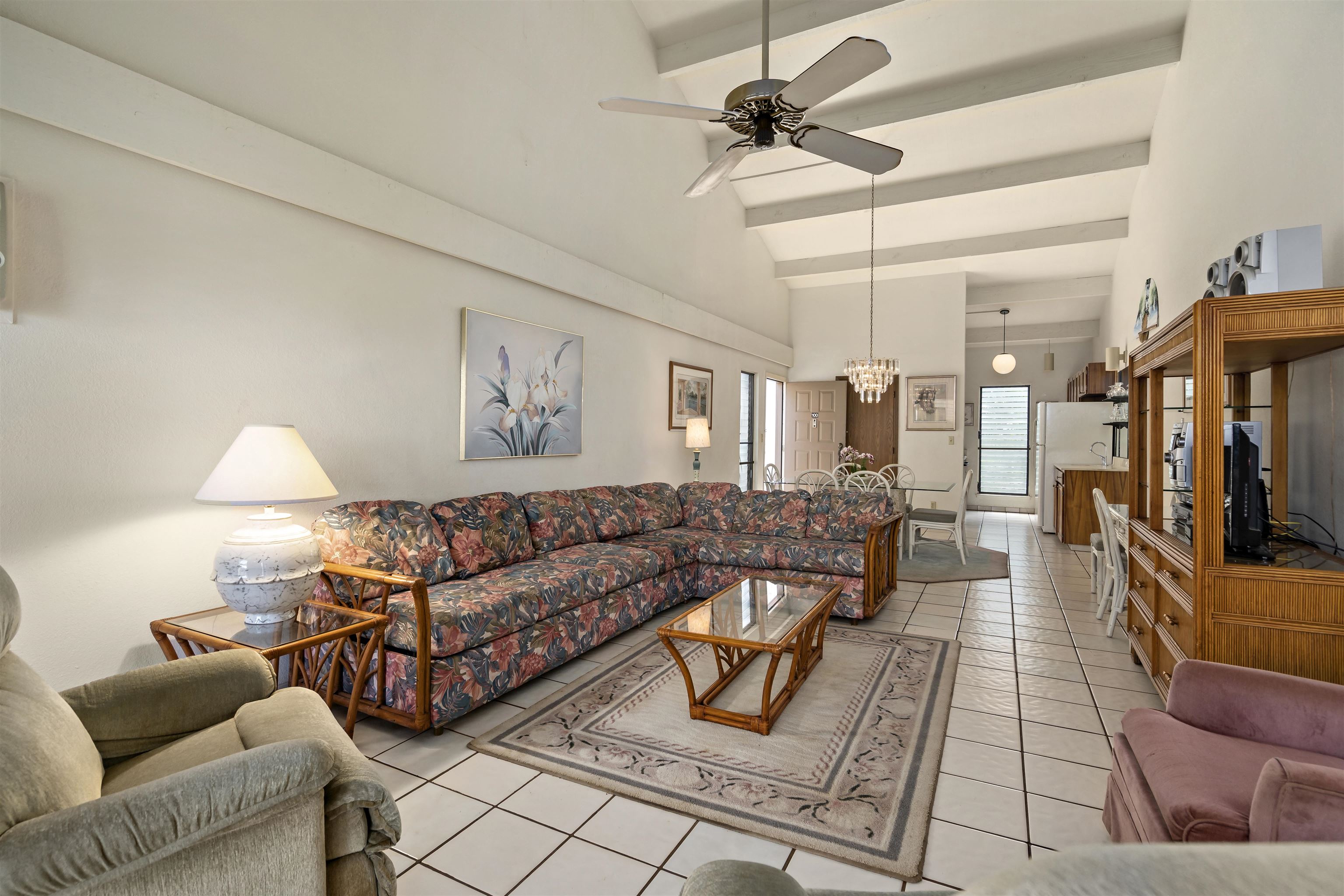 2881 South Kihei Road, Unit 100 Kihei, HI 96753 - Photo 6 of 32 a living room with furniture and a flat screen tv