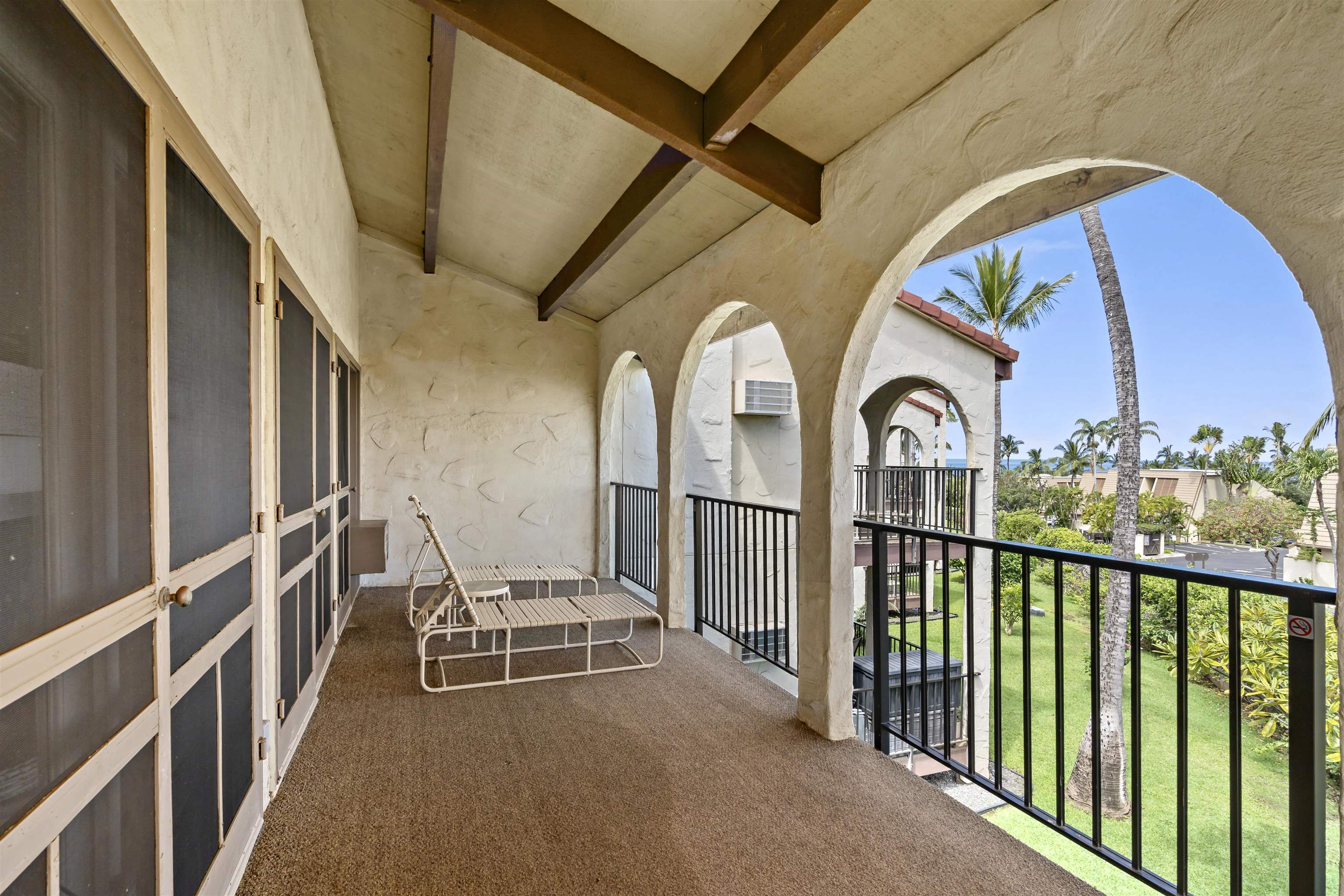 2881 South Kihei Road, Unit 100 Kihei, HI 96753 - Photo 7 of 32 a view of a balcony with chairs