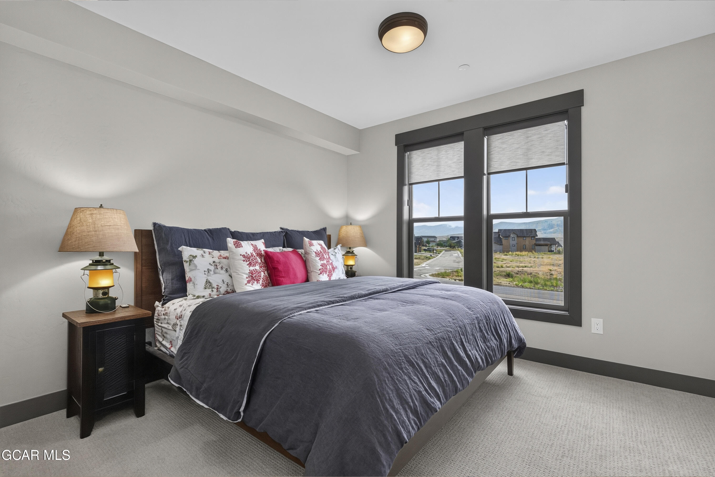 154 Eagle Ridge Drive Granby, CO 80446 - Photo 7 of 59 a bedroom with a bed and window