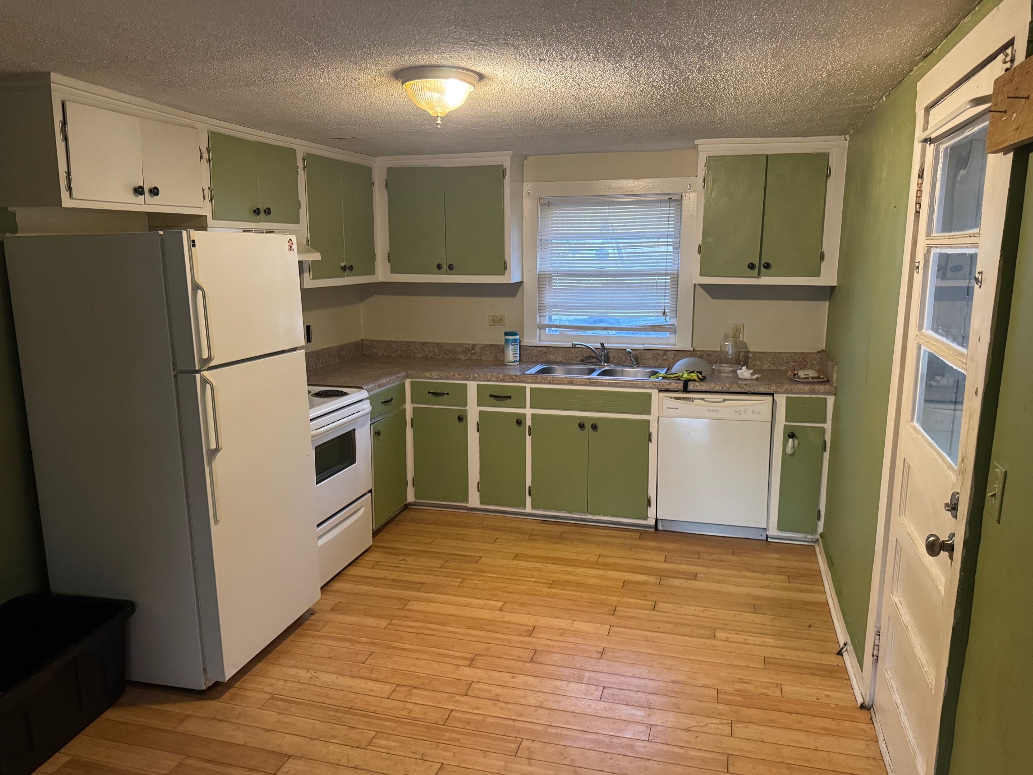 122 Pond Road Dickson, TN 37055 - Photo 3 of 12 a kitchen with a stove top oven and refrigerator