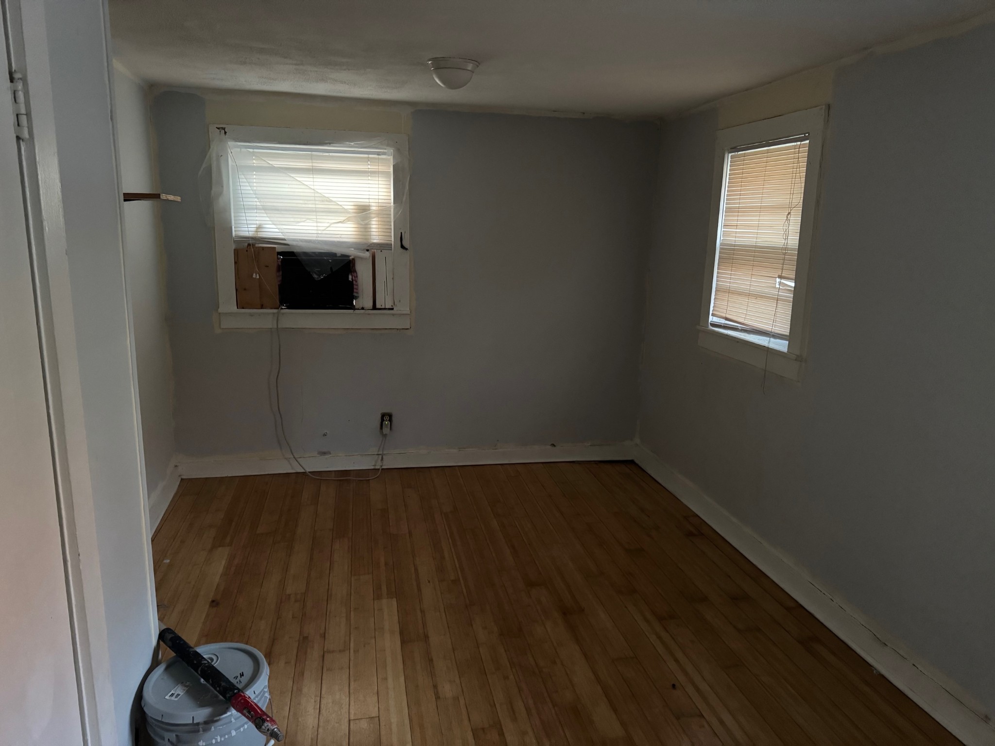 122 Pond Road Dickson, TN 37055 - Photo 6 of 12 an empty room with wooden floor and windows