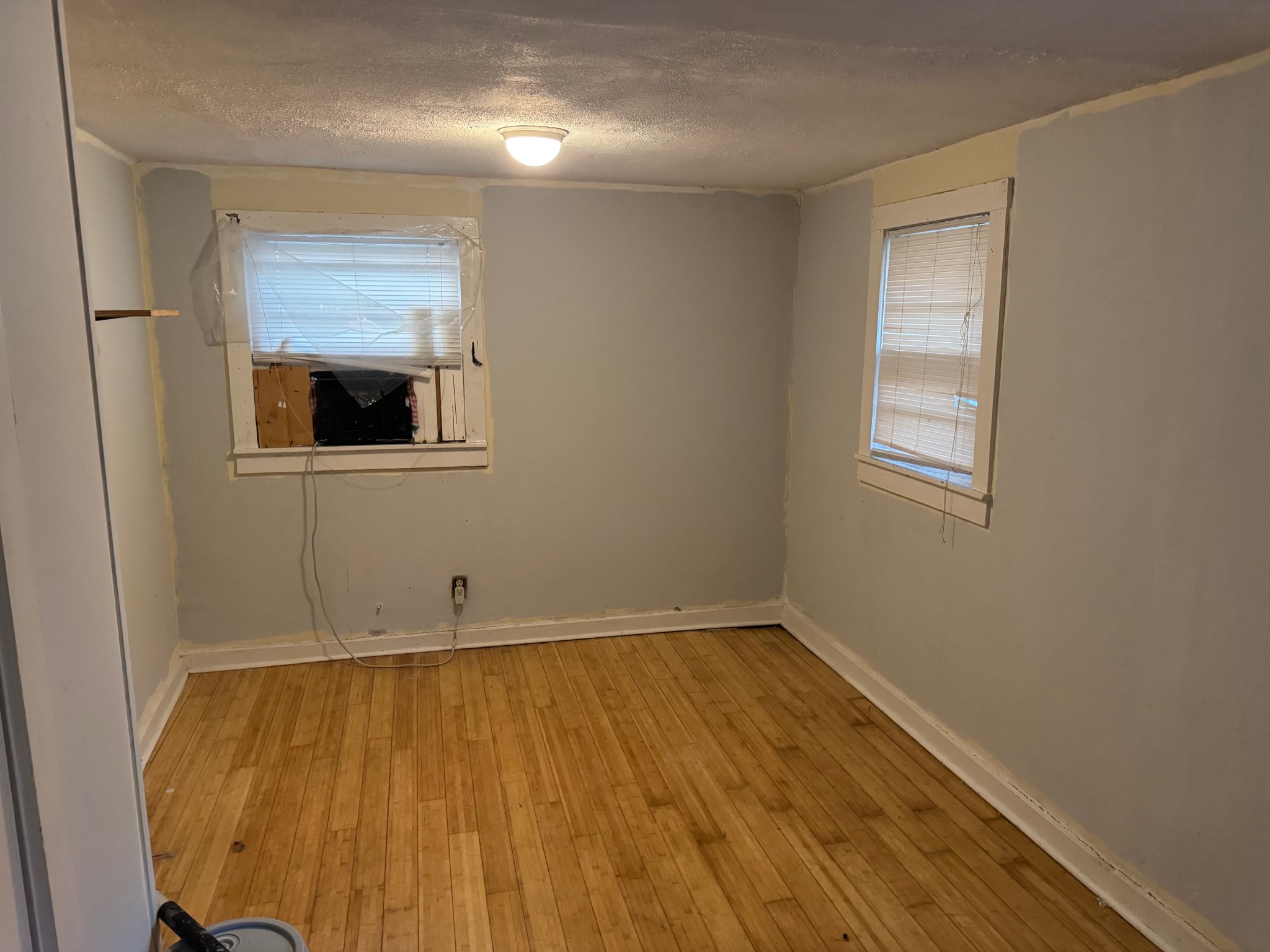 122 Pond Road Dickson, TN 37055 - Photo 7 of 12 an empty room with wooden floor and windows