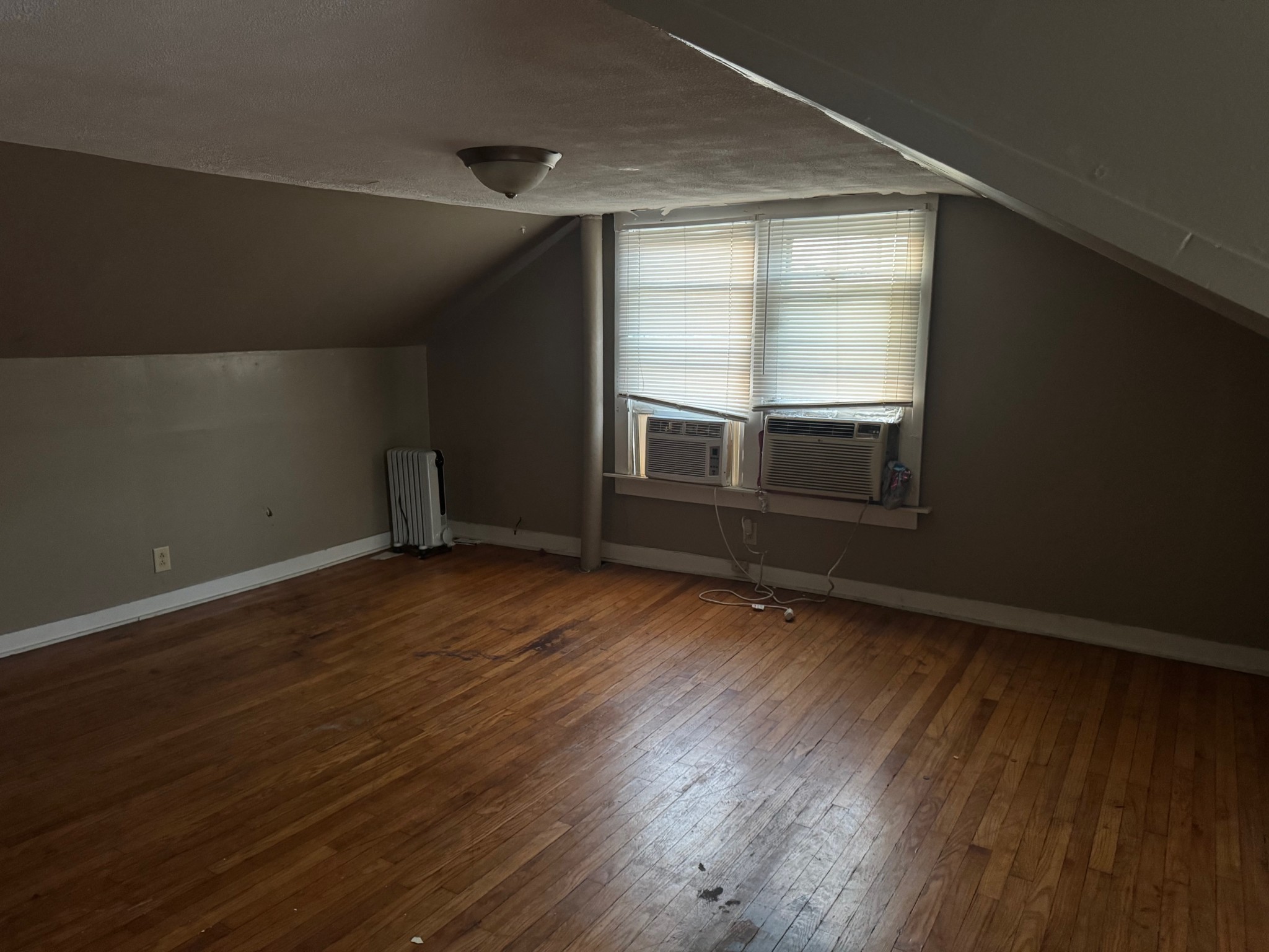 122 Pond Road Dickson, TN 37055 - Photo 8 of 12 an empty room with wooden floor and windows