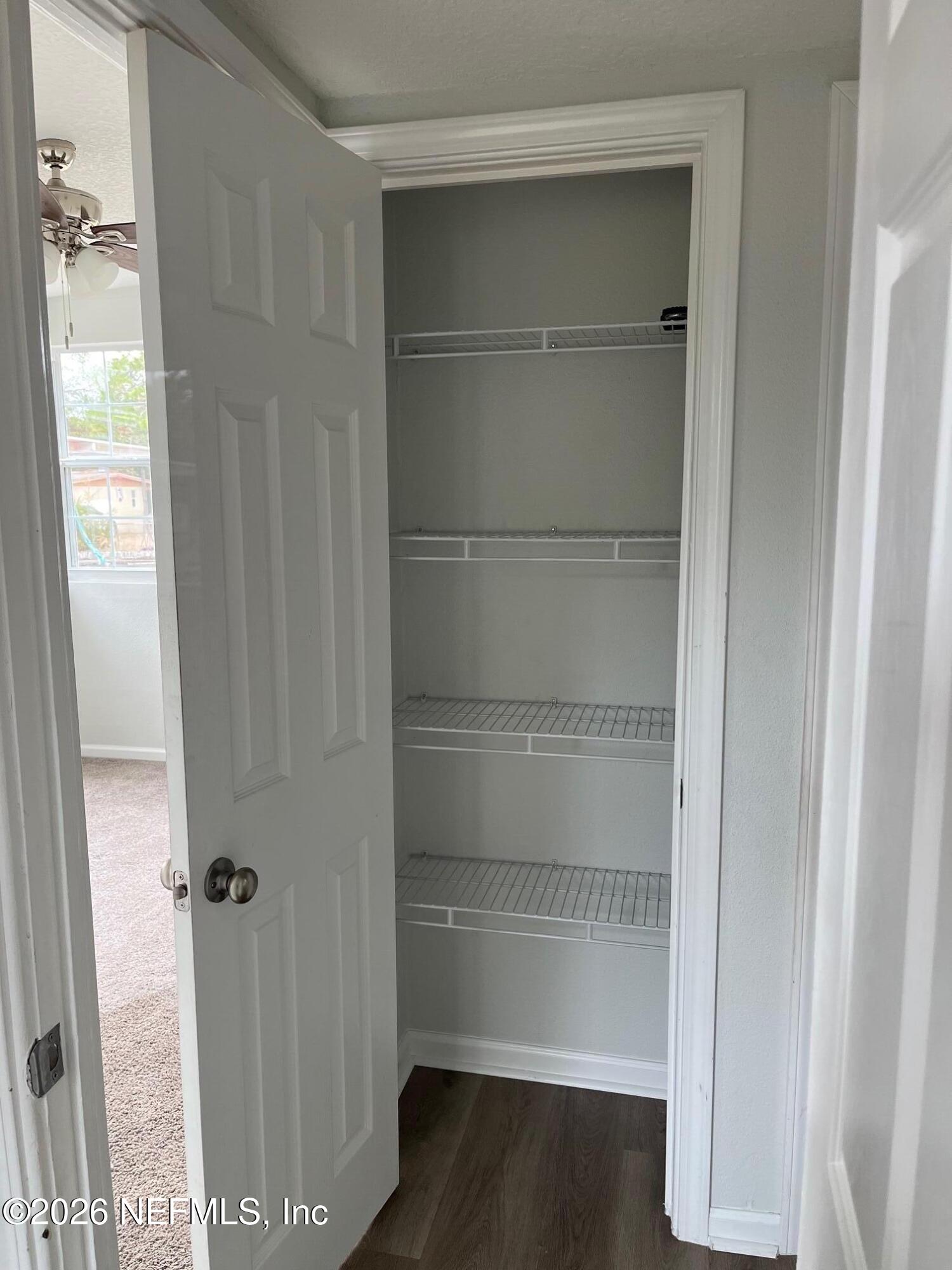 10547 Briarcliff Road East Jacksonville, FL 32218 - Photo 9 of 33 a view of walk in closet with empty racks