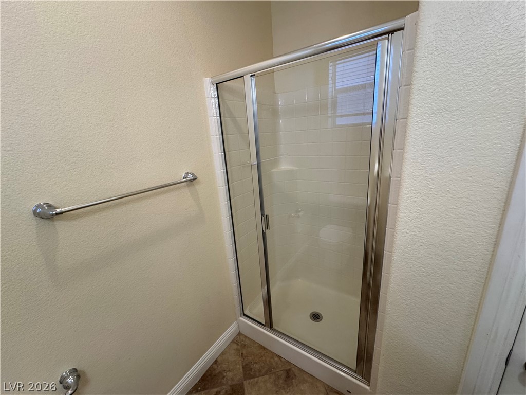 1333 Jamesbury Road Las Vegas, NV 89135 - Photo 6 of 43 Glass-enclosed shower in this bathroom offers a functional and clean bathing space.