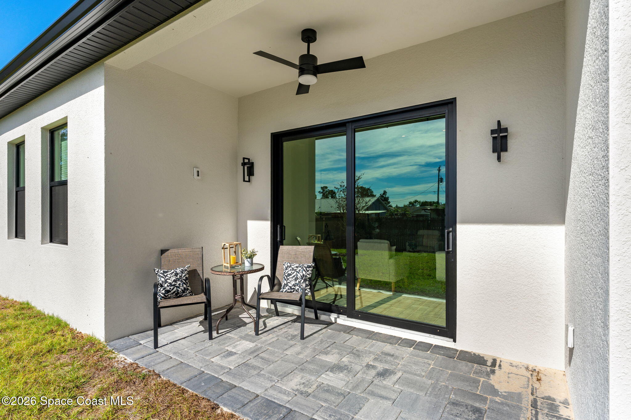 4555 Kings Highway Cocoa, FL 32927 - Photo 11 of 12 a living room with a fireplace furniture a rug and a window