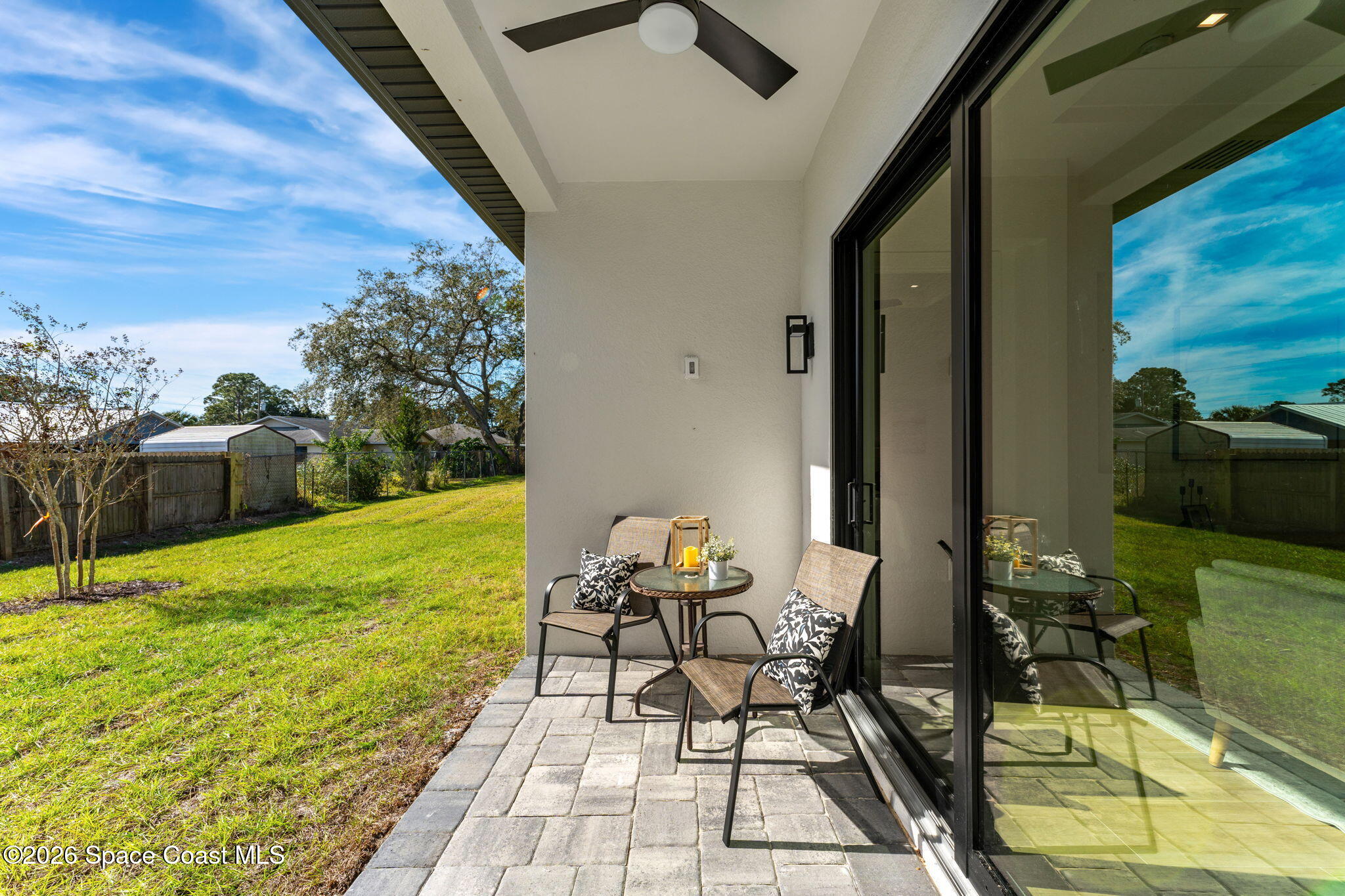 4555 Kings Highway Cocoa, FL 32927 - Photo 12 of 12 a patio with yard table and chairs
