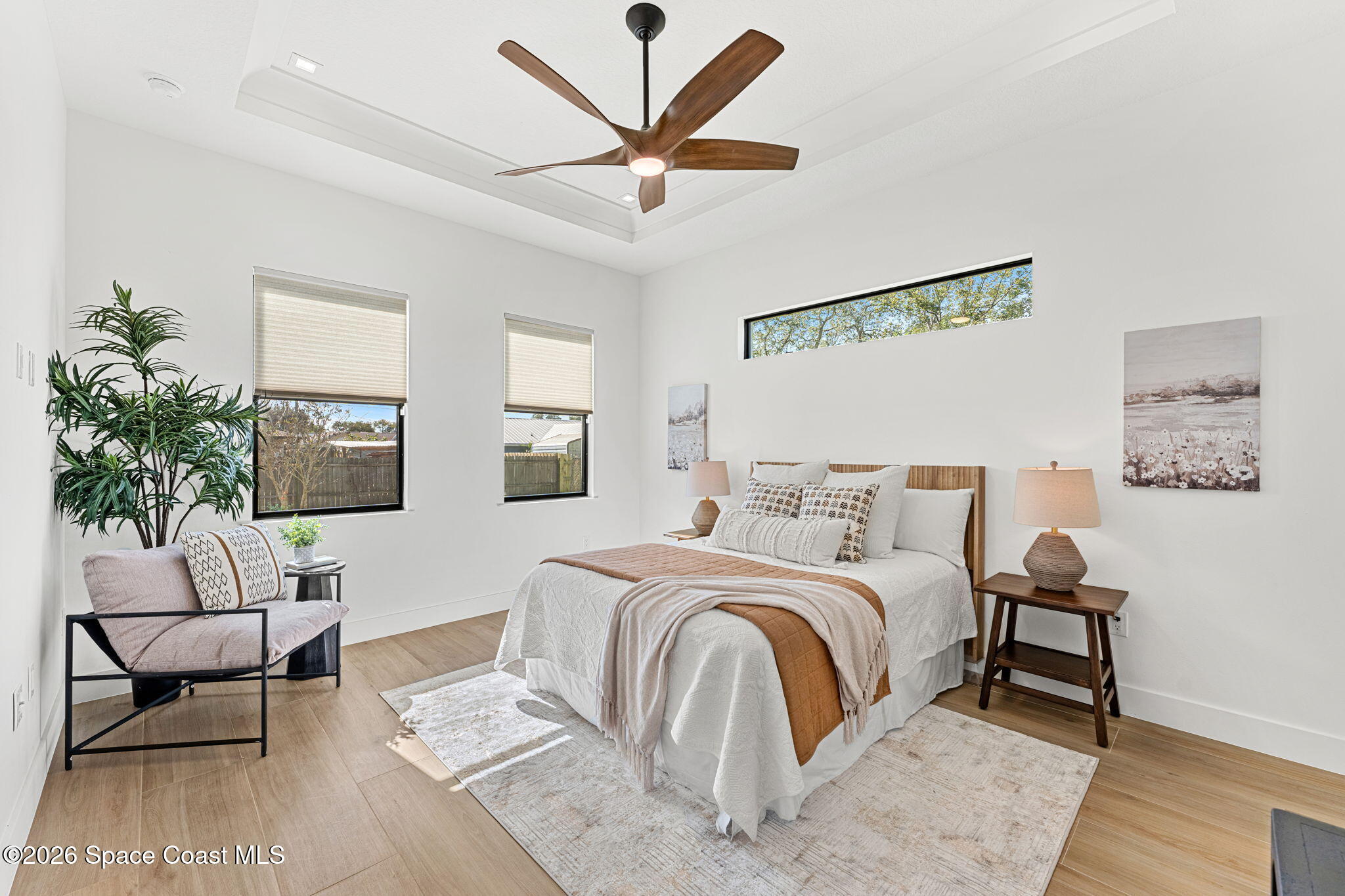 4555 Kings Highway Cocoa, FL 32927 - Photo 7 of 12 a bedroom with a bed and a couch