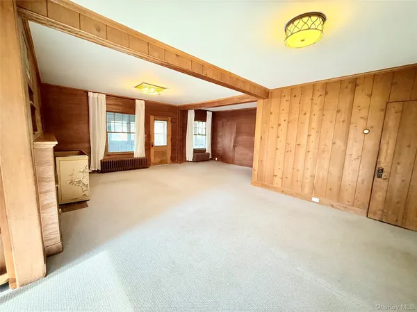 a view of a room with a window and couch