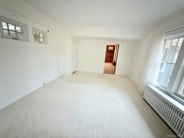 a view of an empty room and window