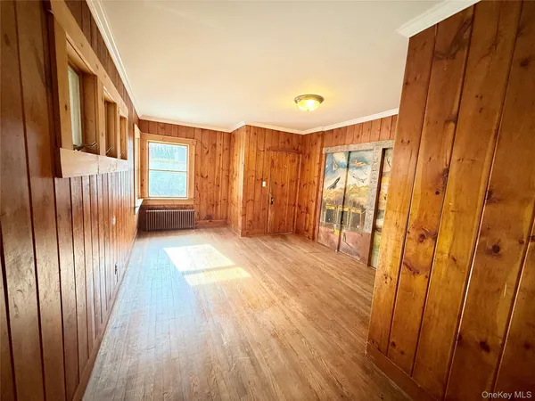 a view of entryway with wooden floor