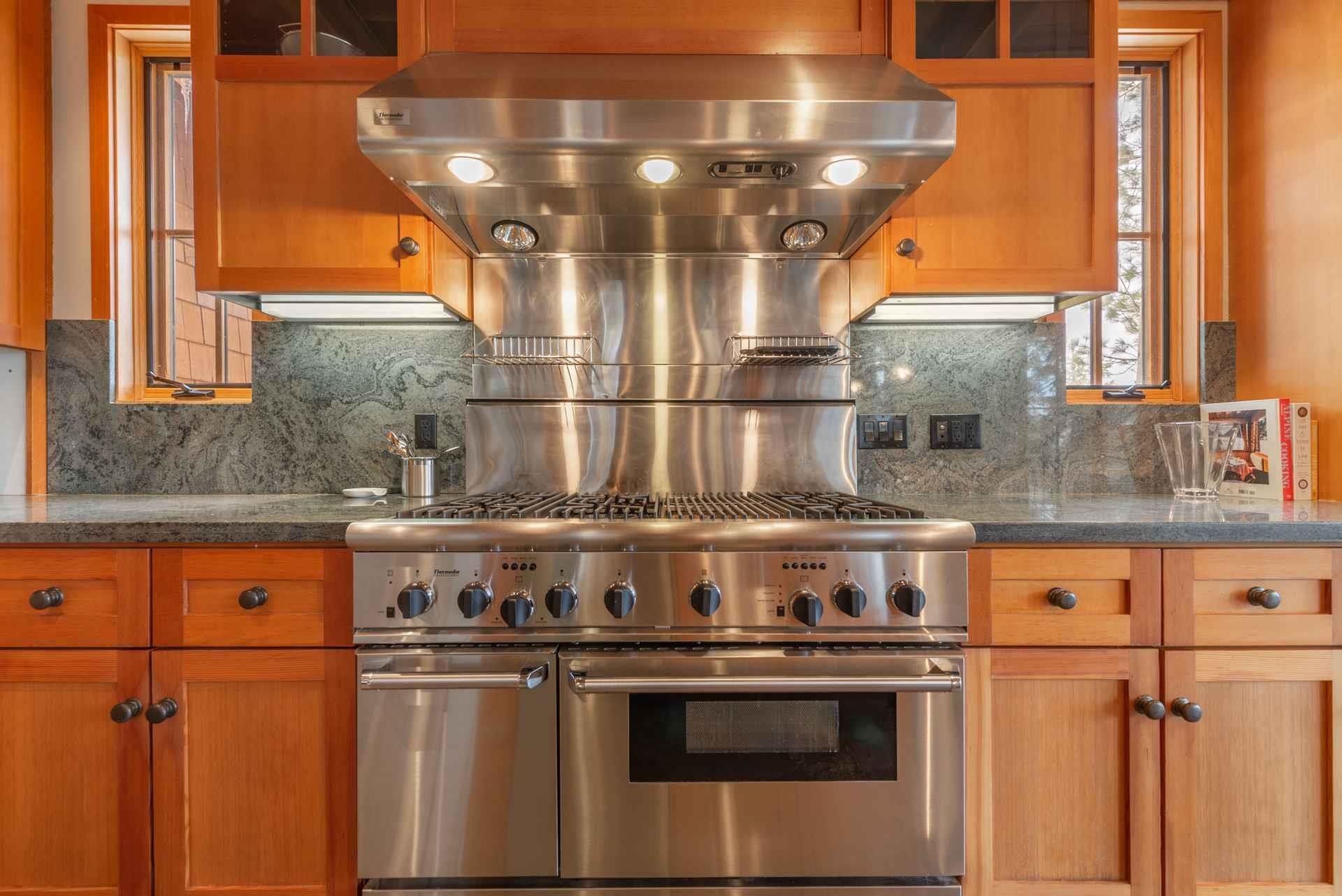 1723 Grouse Ridge Road Truckee, CA 96161 - Photo 14 of 21 a stove top oven sitting inside of a kitchen