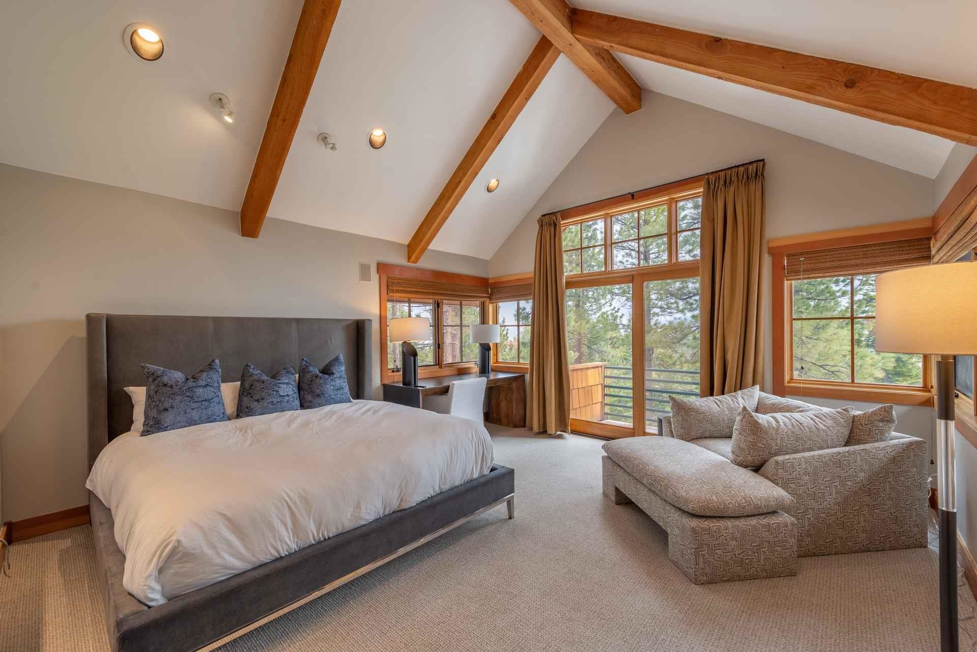1723 Grouse Ridge Road Truckee, CA 96161 - Photo 18 of 21 a bedroom with a large bed couch and a large window