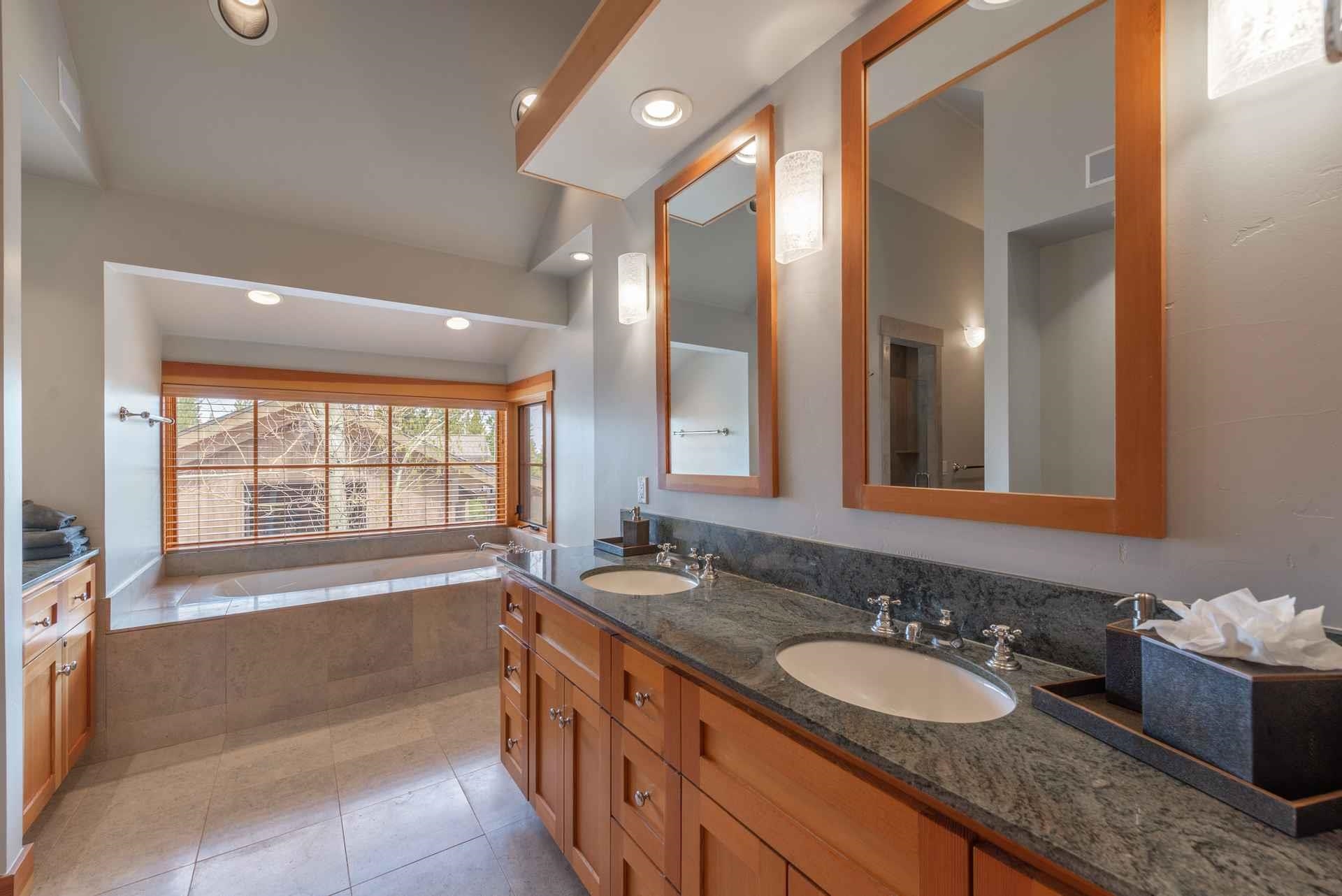 1723 Grouse Ridge Road Truckee, CA 96161 - Photo 19 of 21 a bathroom with a granite countertop tub sink and mirror