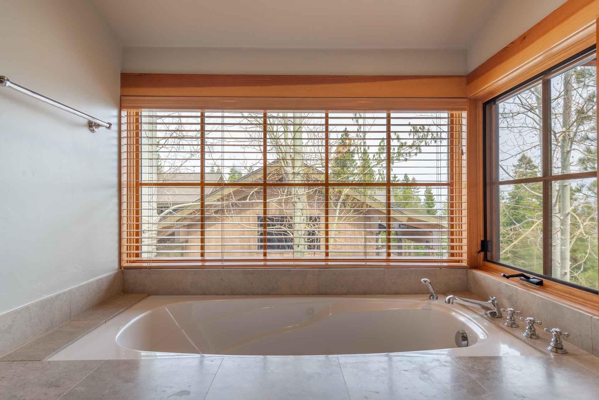 1723 Grouse Ridge Road Truckee, CA 96161 - Photo 20 of 21 a bath tub sitting in a bathroom next to a window