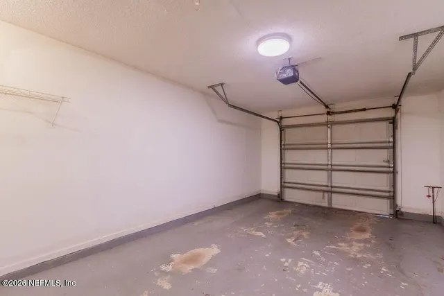 a view of room that has a white walls