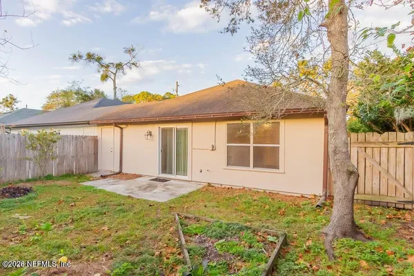a front view of a house with a yard outdoor seating and garage