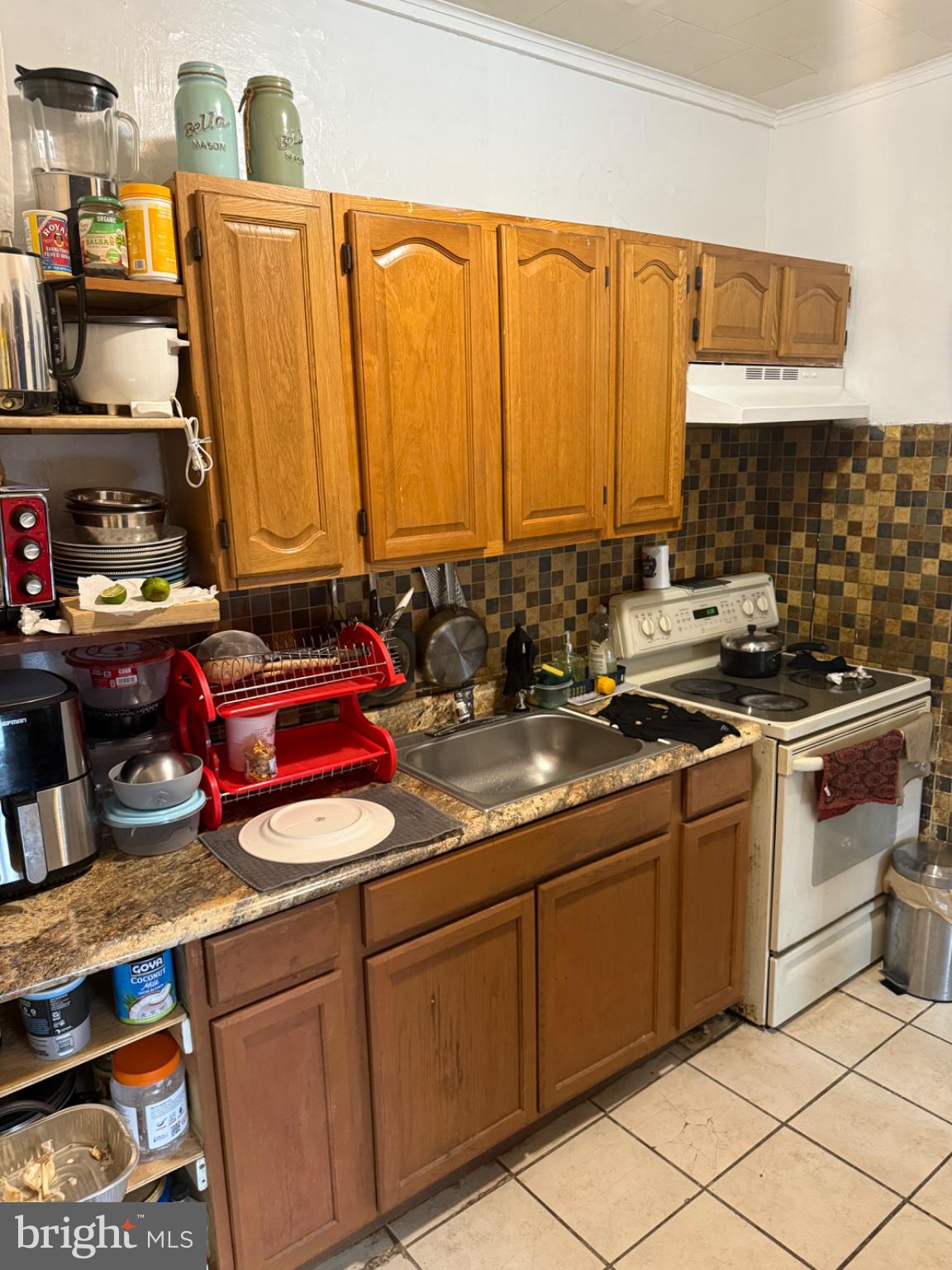 115 West Elm Street Reading, PA 19601 - Photo 5 of 13 Cozy kitchen with warm wooden tones.