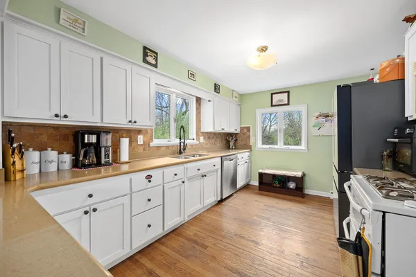 a kitchen with a stove a refrigerator and a refrigerator