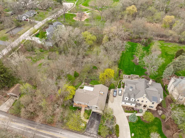 a aerial view of a house with a yard
