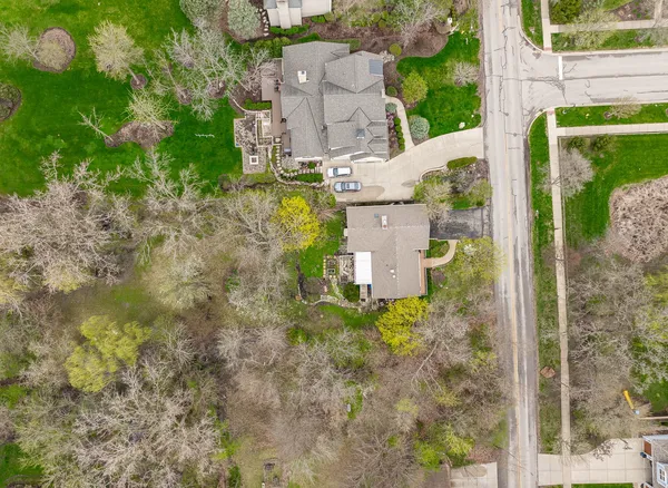 an aerial view of a house with lots of trees