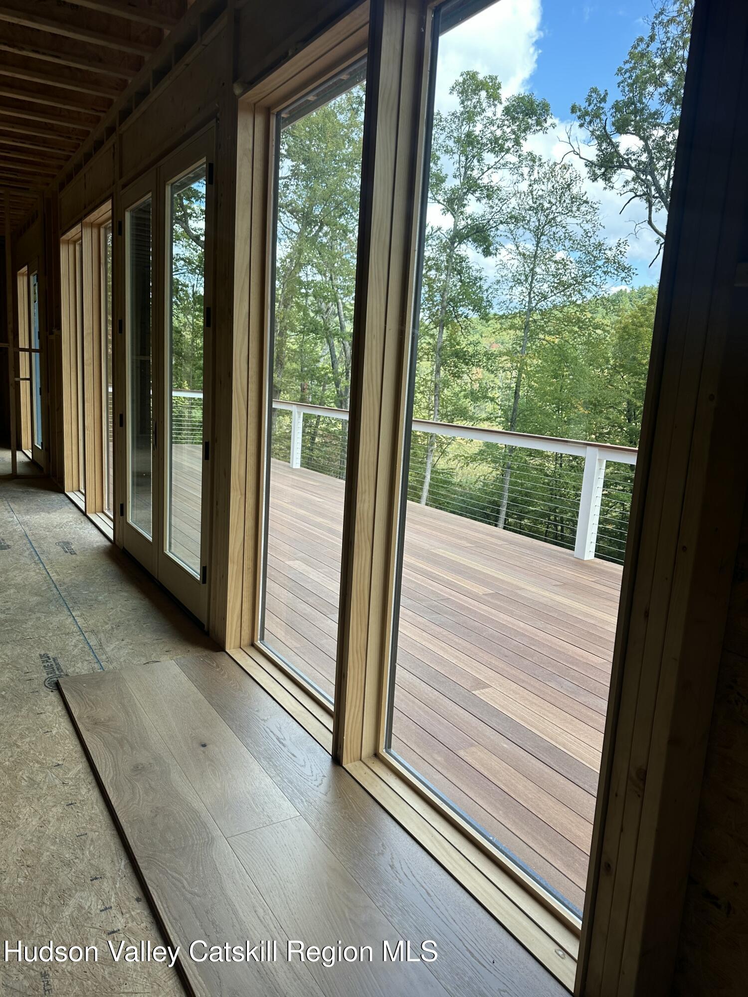 801 Rodman Road Hillsdale, NY 12529 - Photo 16 of 25 a view of balcony with floor to ceiling window