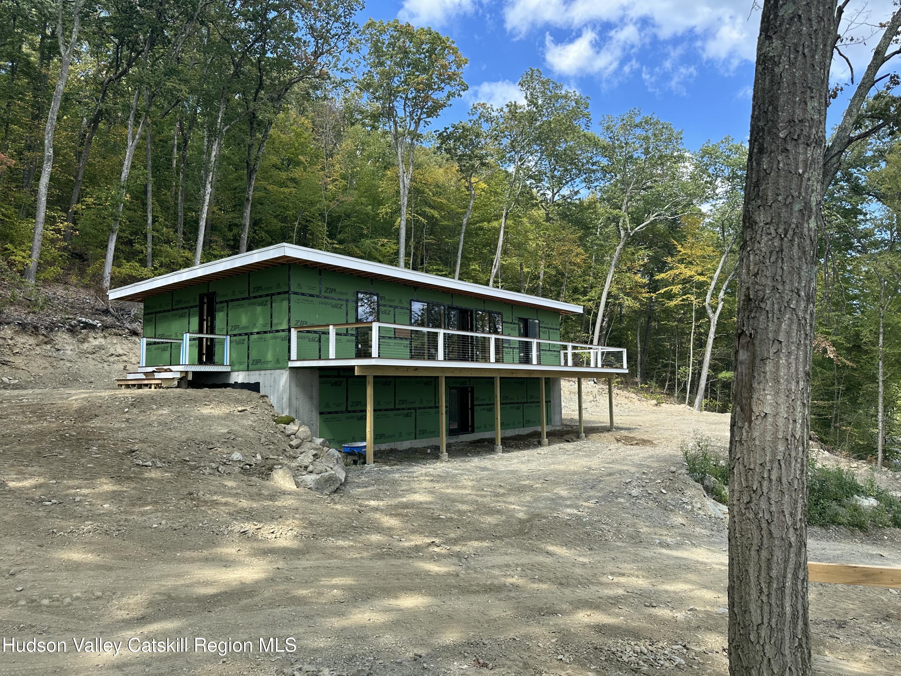 801 Rodman Road Hillsdale, NY 12529 - Photo 2 of 25 a view of a house with a yard and balcony