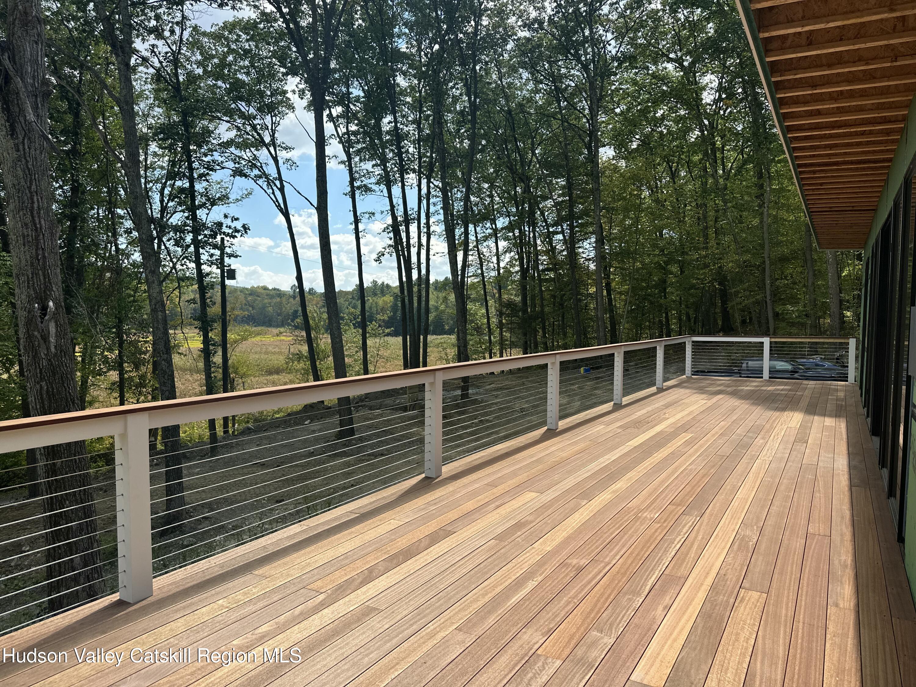 801 Rodman Road Hillsdale, NY 12529 - Photo 6 of 25 a view of balcony with wooden floor and fence