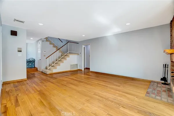 a view of an empty room with stairs