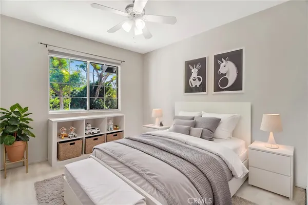 a bedroom with a large bed and a window