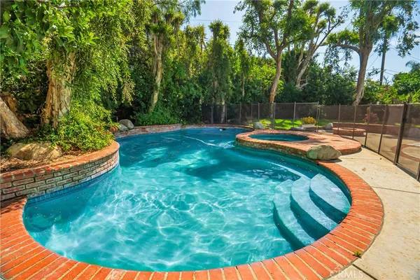 a view of a swimming pool with a sitting space