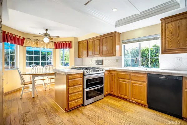a kitchen with stainless steel appliances granite countertop a stove and a sink