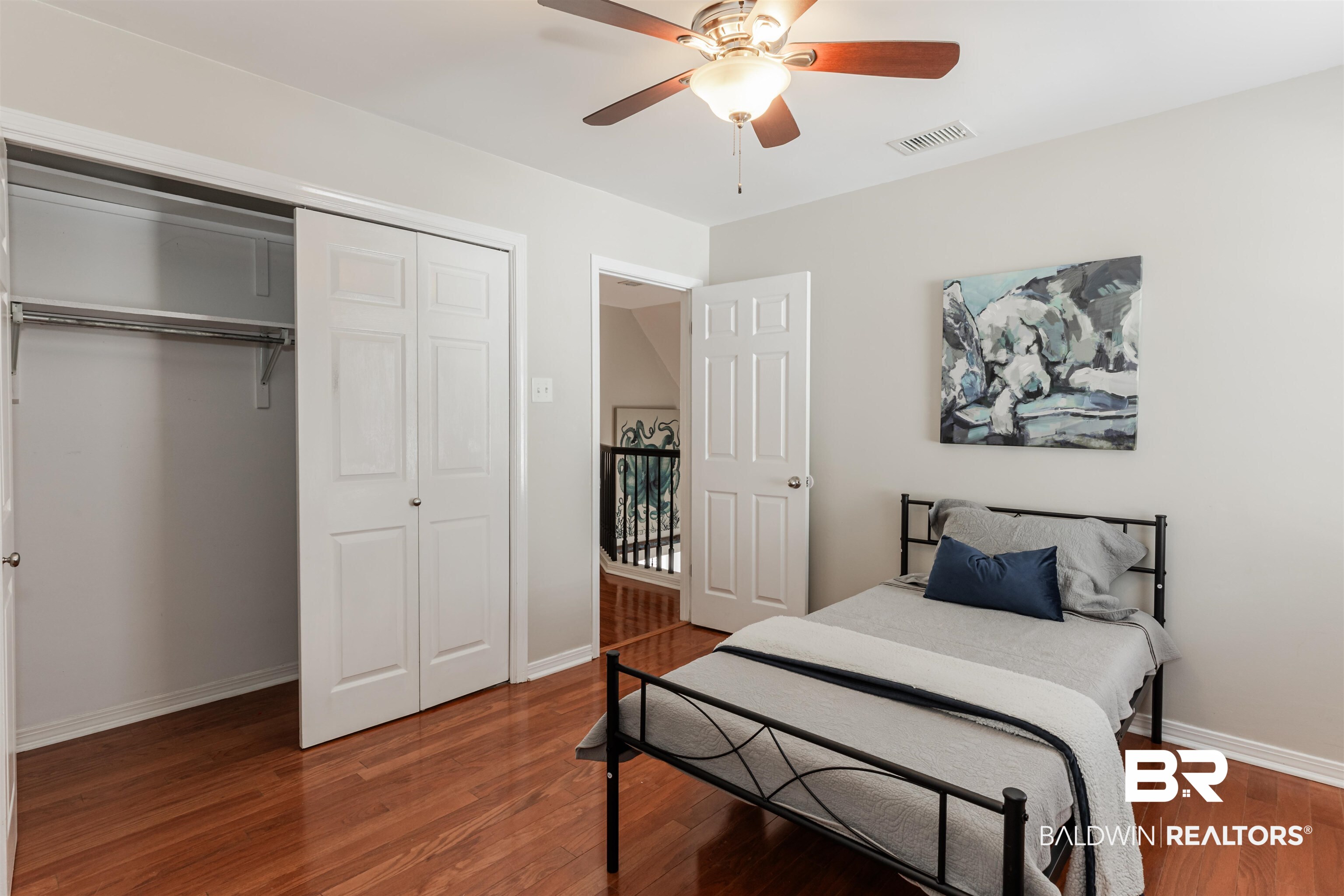 3844 Isabel Way South Mobile, AL 36693 - Photo 35 of 49 Bedroom with hardwood / wood-style flooring, ceiling fan, and a closet