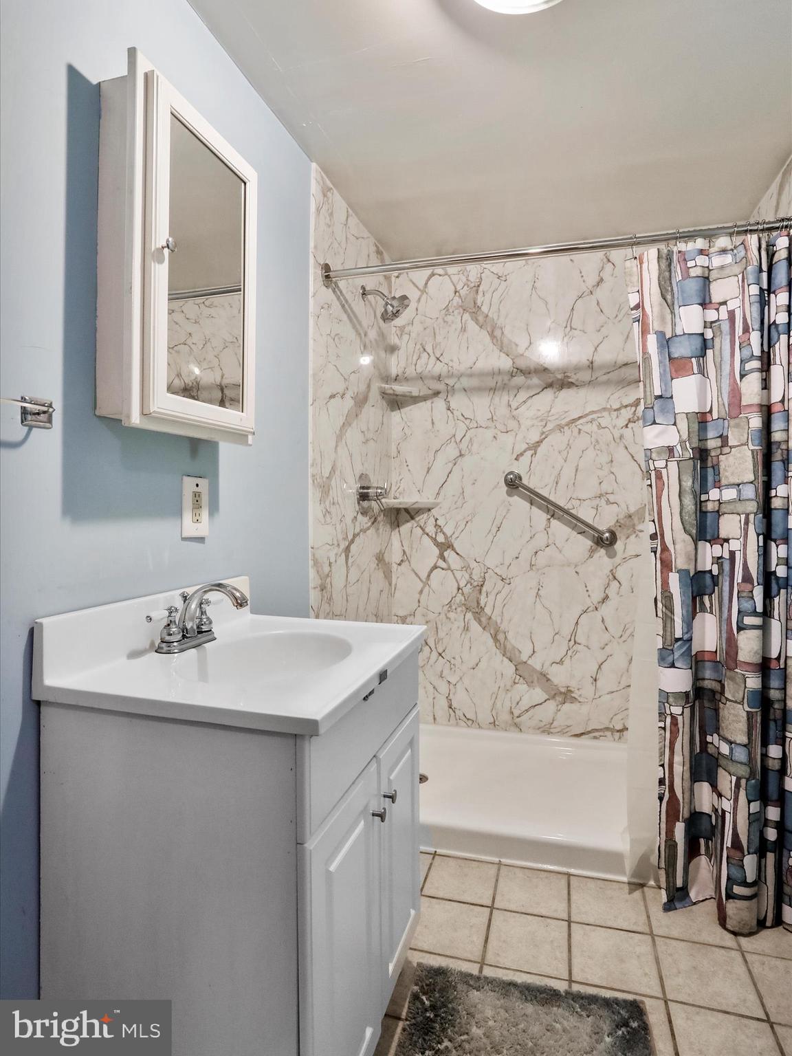 867 Mason Road Hedgesville, WV 25427 - Photo 24 of 39 a bathroom with a sink mirror and a shower