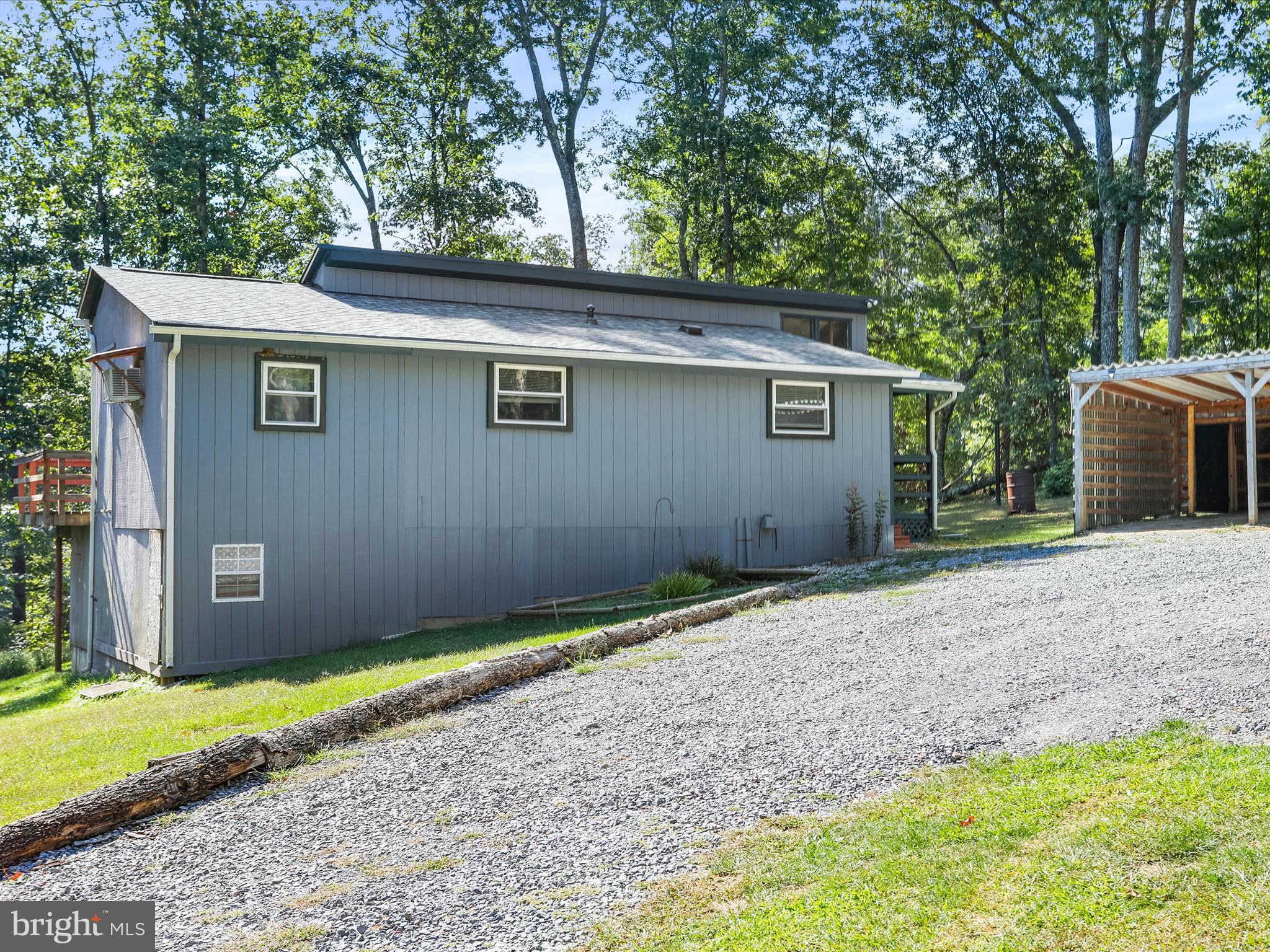867 Mason Road Hedgesville, WV 25427 - Photo 30 of 39 a view of backyard of house with wooden fence