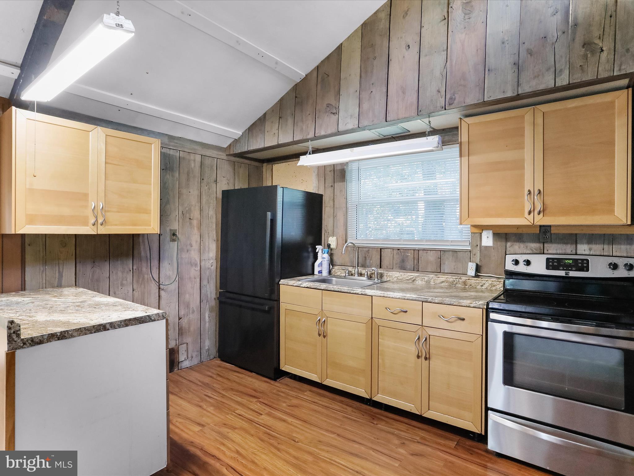 867 Mason Road Hedgesville, WV 25427 - Photo 6 of 39 a kitchen with a sink stove and refrigerator
