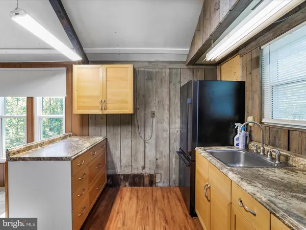 a kitchen with a sink stove and refrigerator