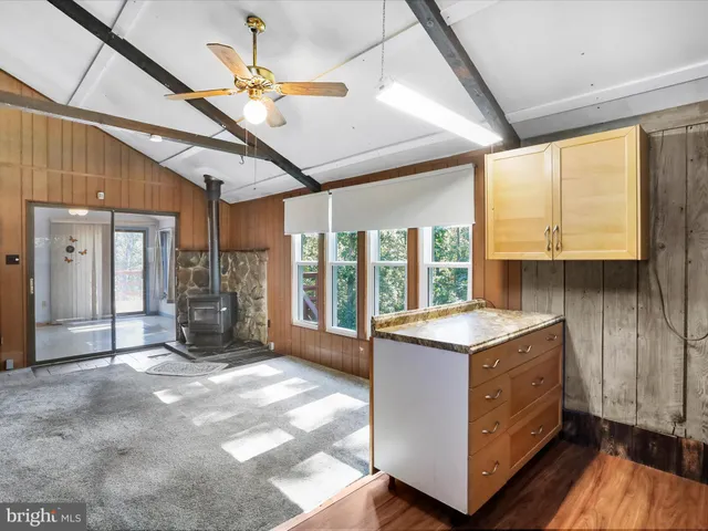 a kitchen with a stove a sink and a refrigerator
