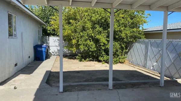 a sign board with yard in front of it