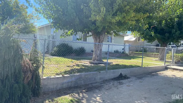 a view of a swimming pool with a backyard