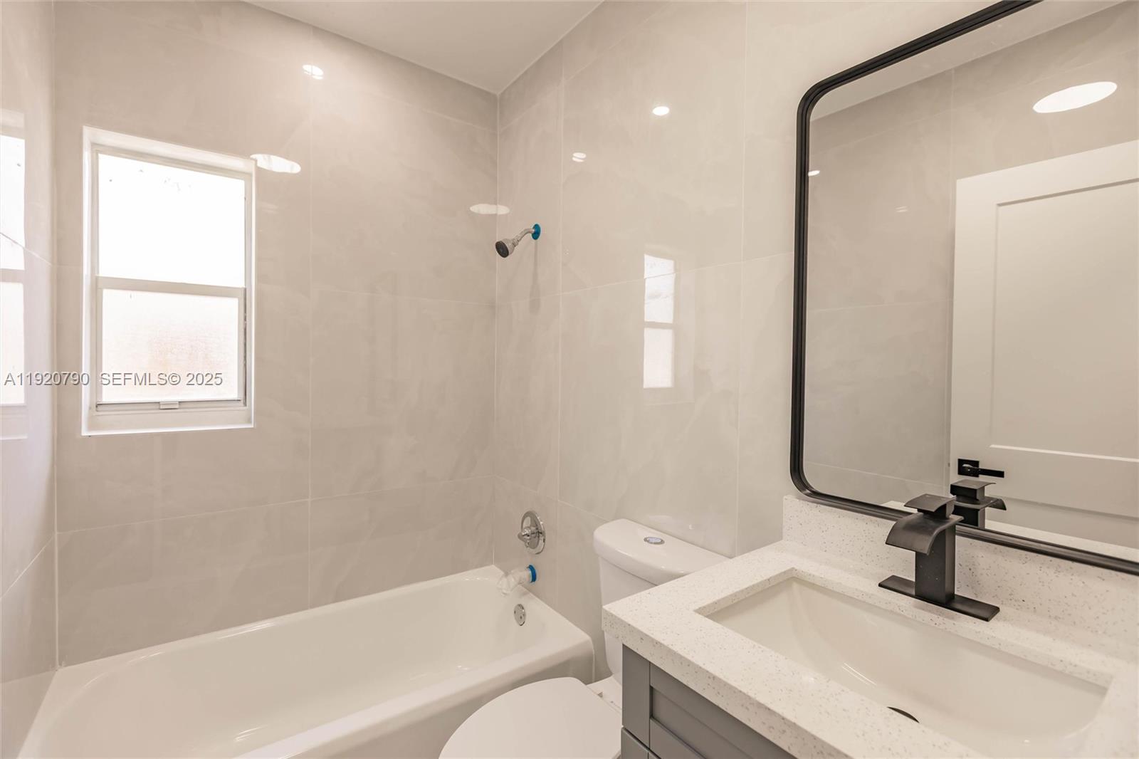 3180 Northwest 2nd Street Miami, FL 33125 - Photo 14 of 29 a bathroom with a sink and a bathtub