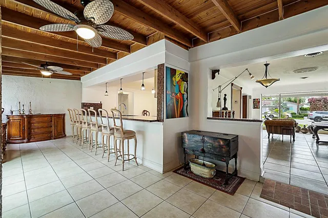a view of a chairs and tables in the room