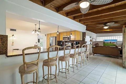 a kitchen with refrigerator cabinets and furniture