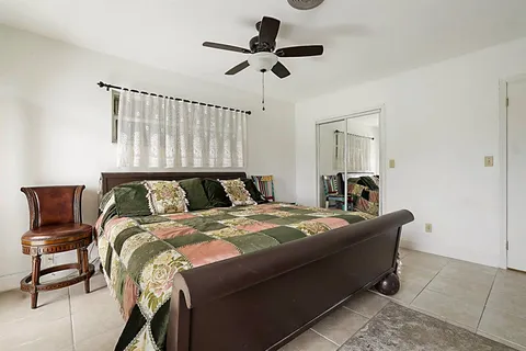 a en suite bathroom with a toilet a sink and mirror